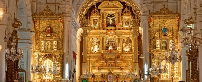 Interior view of the ornate altar and marble columns at Basilica of Bom Jesus in Goa, India