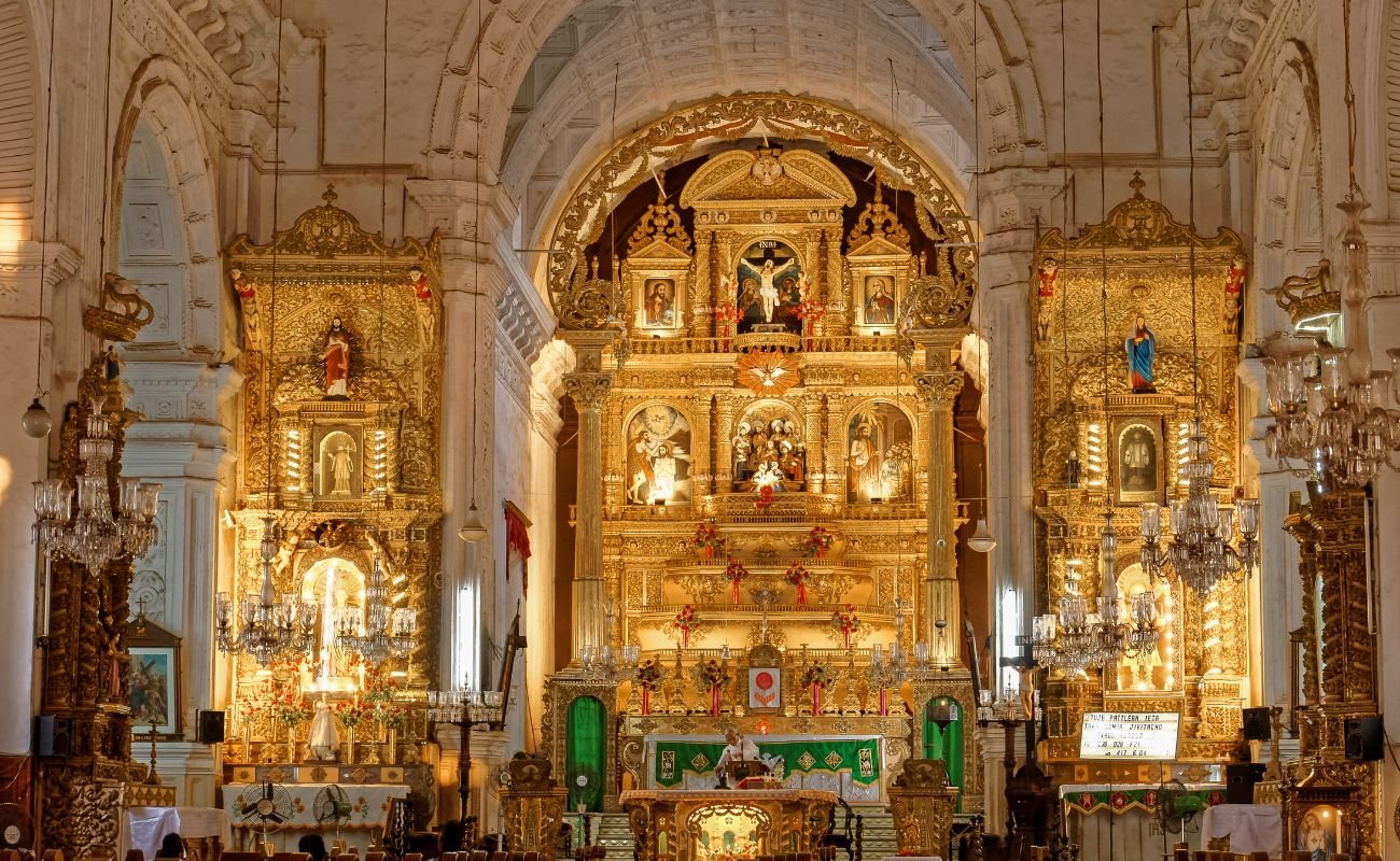 Interior view of the ornate altar and marble columns at Basilica of Bom Jesus in Goa, India