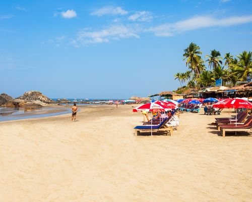 Goa beach with deckchairs on shore